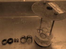 Rings, balls, ball-centering guides and ring holder